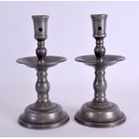 A PAIR OF 18TH CENTURY CONTINENTAL PEWTER CANDLESTICKS with circular drip pans. 20 cm high.
