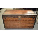 A GOOD LARGE EARLY FRENCH LOUIS VUITTON TRAVELLING TRUNK with iron work handles and iron binding,