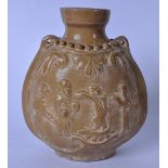 A MIDDLE EASTERN BROWN GLAZED POTTERY VASE, decorated in relief with figures. 18.5 cm.