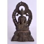AN 18TH/19TH CENTURY CHINESE TIBETAN BRONZE BUDDHA modelled seated in front of a flaming surround,