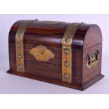 A MID VICTORIAN CARVED ROSEWOOD AND BRASS DOME TOP CASKET engraved with foliage and vines. 24 cm x