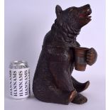 A LARGE 19TH CENTURY BAVARIAN BLACK FOREST MUSICAL TOBACCO JAR in the form of a seated brown bear.