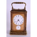 A 19TH CENTURY FRENCH ENGRAVED BRASS REPEATING CARRIAGE CLOCK the two circular white dials with