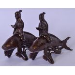 A PAIR OF CHINESE BRONZE FISH, formed with removable male riders. 15 cm wide.