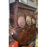 AN 18TH CENTURY OAK COURT CUPBOARD, with fitted drawers, panelled doors and swan neck brass handles.