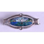 A STYLISH ENGLISH SILVER AND ENAMEL MARITIME BROOCH painted with a boat upon crashing waves. 3 cm