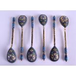 A GROUP OF SIX LATE 19TH CENTURY RUSSIAN CHAMPLEVE ENAMEL SPOONS decorated with foliage. 5.5 oz.