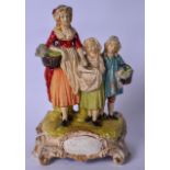 A VINTAGE YARDLEY PLASTER CHEMIST ADVERTISING FIGURE, formed as mother and two daughters on a