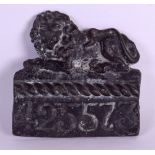 AN EARLY 19TH CENTURY ENGLISH BRONZED LEAD PLAQUE in the form of a recumbent lion over numerals '