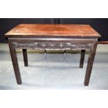 AN EARLY 20TH CENTURY CHINESE ROSEWOOD TABLE with carved frieze formed with precious objects. 65