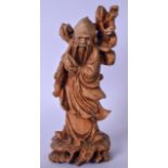 AN EARLY 20TH CENTURY CHINESE CARVED HARDWOOD STATUE OF SAGE, formed holding a peach. 21 cm high.