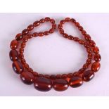 AN EARLY 20TH CENTURY AMBER NECKLACE.70 grams. 70 cm long.