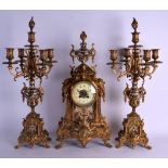 A LATE 19TH CENTURY FRENCH BRONZE AND CHAMPLEVE ENAMEL CLOCK GARNITURE decorated with foliage and