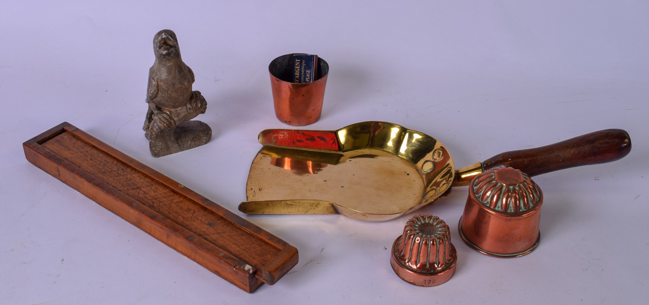 TWO EARLY 20TH CENTURY COPPER CHOCOLATE MOULDS, together with carved soapstone bird etc. (qty)