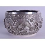 A 19TH CENTURY INDIAN SILVER EMBOSSED BUDDHISTIC BOWL decorated in relief with figures and