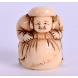 AN EARLY 19TH CENTURY JAPANESE EDO PERIOD CARVED IVORY NETSUKE modelled as a male leaning over a