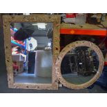 TWO 20TH CENTURY CARVED WOODEN MIRRORS, with scrolling floral inspired frames. Largest 111 cm x 78