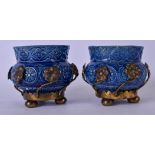 A PAIR OF EARLY 20TH CENTURY CONTINENTAL PORCELAIN VASES, decorated in relief with flowers and metal