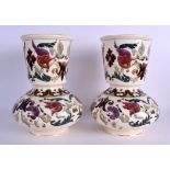 A PAIR OF AUSTRO HUNGARIAN RUDOLF DITMAR VASES Zsolnay style, painted with flowers. 25 cm high.
