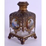A 19TH CENTURY FRENCH GRAND TOUR BRASS OVERLAID SCENT BOTTLE decorated with figures and