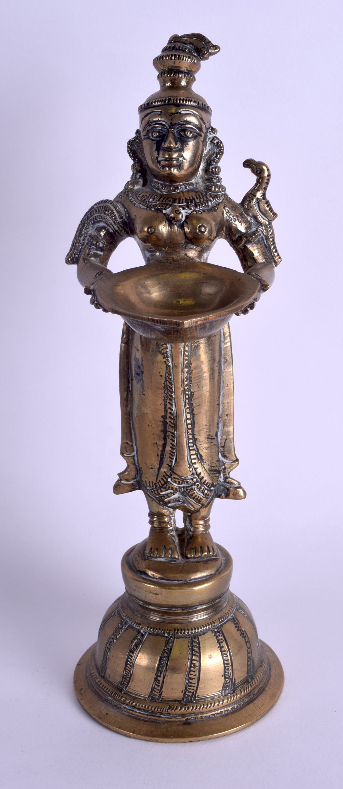 A 19TH CENTURY INDIAN BRONZE FIGURE OF A STANDING BUDDHISTIC DEITY modelled holding aloft an open