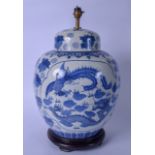 A HUGE CHINESE BLUE AND WHITE PORCELAIN VASE / LAMP, decorated with a dragon and phoenix bird