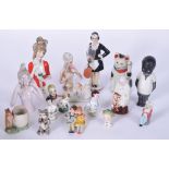 A QUANTITY OF PORCELAIN FIGURES, including a porcelain timer, a cat and bisque boy etc. (qty)