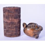 A 20TH CENTURY JAPANESE CARVED WOODEN NETSUKE IN THE FORM OF A LIZARD BURSTING FROM AN EGG, together