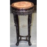 A LARGE 19TH CENTURY CHINESE MARBLE INSET LOBED HARDWOOD STAND Qing, carved with foliage upon claw