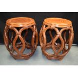 A PAIR OF EARLY 20TH CENTURY CHINESE CARVED HARDWOOD BARREL SEATS Qing/Republic, of openwork form