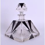 A FRENCH ART DECO BLACK AND CLEAR GLASS SCENT BOTTLE. 14 cm x 10 cm.