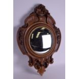 A 19TH CENTURY CONTINENTAL CARVED WOOD MIRROR overlaid with flowers and urns, signed to reverse '