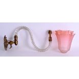 A LATE 19TH CENTURY GILT METAL AND CRYSTAL TWISTED WALL SCONCE with pink glass shade. 36 cm long. (