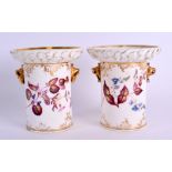 A PAIR OF 19TH CENTURY COALPORT PORCELAIN SPILL VASES with bird beak ring handles, painted with