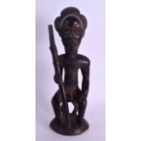 AN EARLY 20TH CENTURY AFRICAN TRIBAL HARDWOOD FIGURE modelled as a hunter holding a weapon. 28 cm