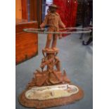 AN UNUSUAL VICTORIAN CAST IRON STICK STAND, in the form of a standing sailor. 70 cm high.