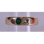 A 9CT GOLD EMERALD AND DIAMOND RING. Size N/O.