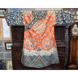 A FINE LARGE 19TH CENTURY CHINESE SILKWORK ORANGE ROBE wonderfully decorated with extensive