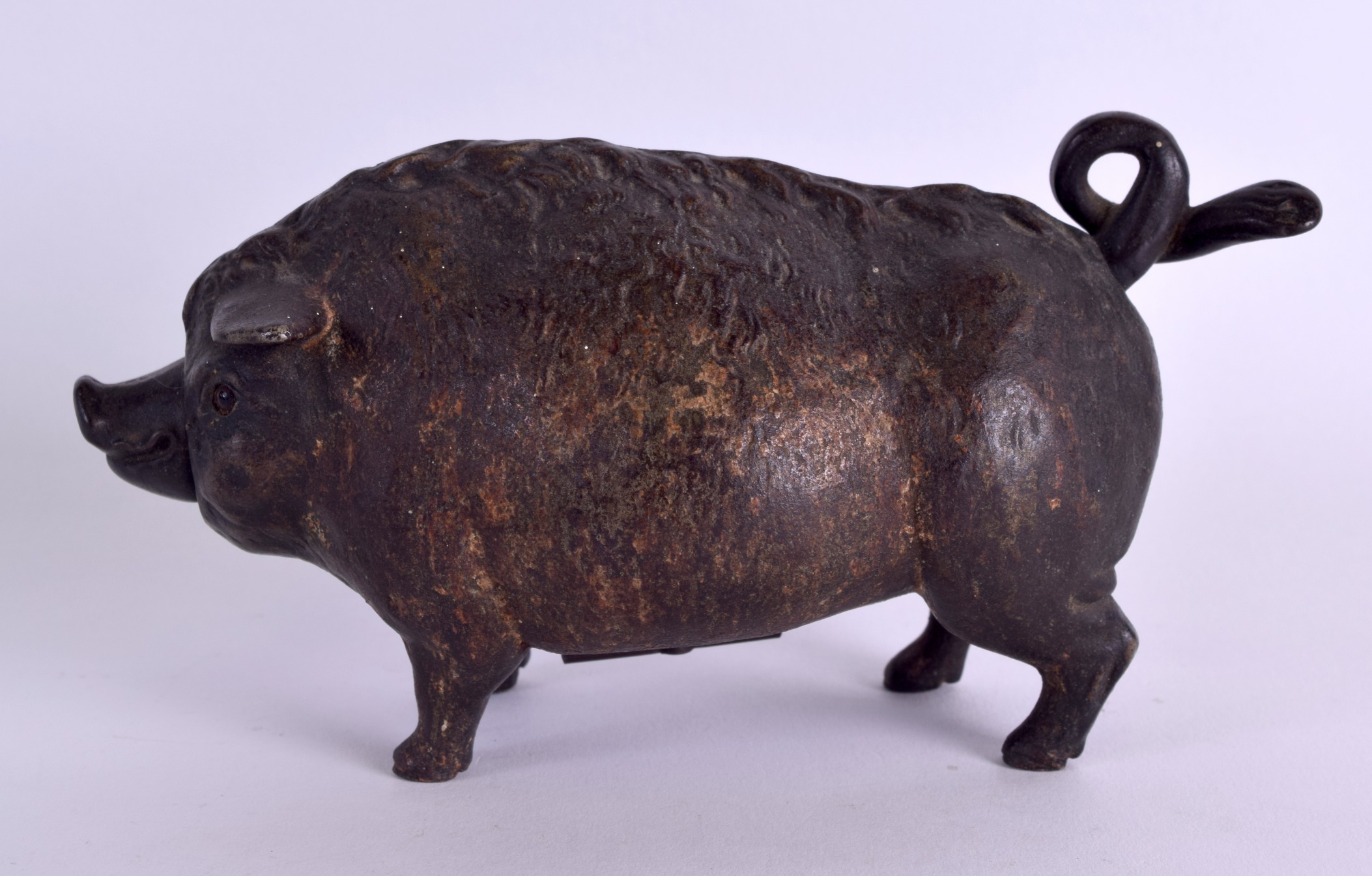 A RARE MID 19TH CENTURY CAST IRON NOVELTY TABLE BELL in the form of a chubby pig, his nose and