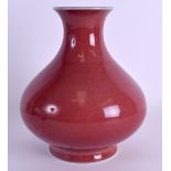 A 19TH CENTURY CHINESE SANG DU BOEUF SQUAT BULBOUS VASE bearing Yongzheng marks to base, of plain