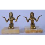 A PAIR OF EARLY 20TH CENTURY BRONZE FIGURES IN THE FORM OF AN EGYPTIAN PRIESTESS, modelled arms