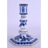 A 19TH CENTURY MEISSEN BLUE AND WHITE PORCELAIN CANDLESTICK painted with an onion type pattern. 13