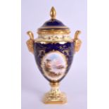 AN EARLY 20TH CENTURY COALPORT TWIN HANDLED VASE AND COVER painted with a landscape. 18 cm high.