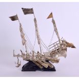 A SMALL 19TH CENTURY CHINESE EXPORT SILVER JUNK BOAT upon a fitted stand. 171 grams overall. 16 cm x