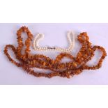 TWO ROWS OF NATURAL AMBER NECKLACES together with a 16 inch cultured pearl necklace. (3)