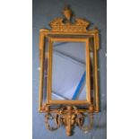 A GOOD 19TH CENTURY FRENCH GILTWOOD MIRROR, the top carved in the form of an urn with artichoke