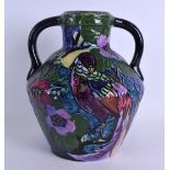 AN UNUSUAL TUBE LINED TWIN HANDLED TROGON WARE VASE decorated with a parrot amongst foliage. 22 cm x