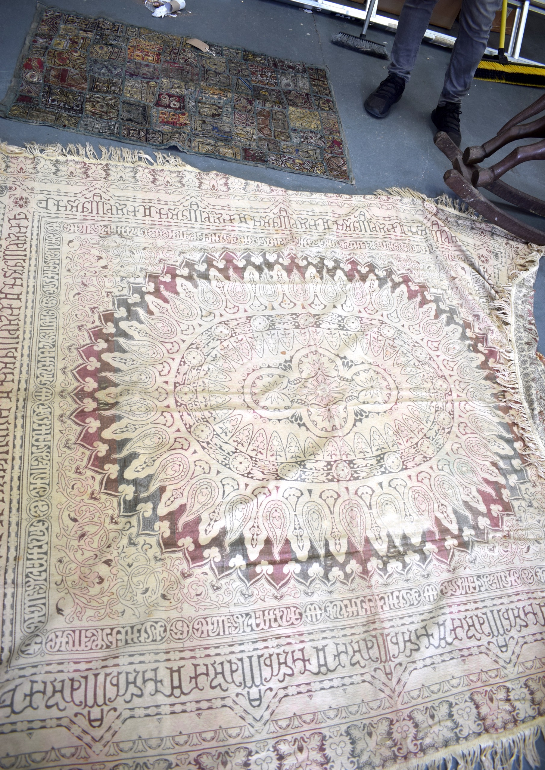A VINTAGE EASTERN EMBROIDERED PANEL, together with another. Largest 220 cm x 180 cm.