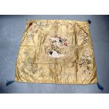 A 19TH CENTURY JAPANESE MEIJI PERIOD EMBROIDERED SILK PANEL depicting opposing cranes within a