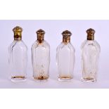 FOUR 19TH CENTURY FRENCH SILVER GILT SCENT BOTTLES. 9.5 cm high. (4)
